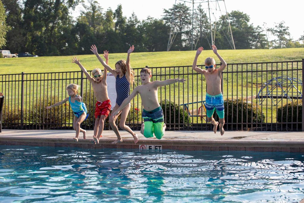 Hawks Landing community image kids jumping in pool